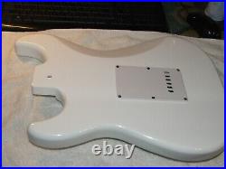 White Loaded Strat Style. Alnico Pickups. White pearloid pickguard. Excellent