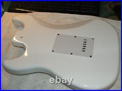 White Loaded Strat Style. Alnico Pickups. White pearloid pickguard. Excellent